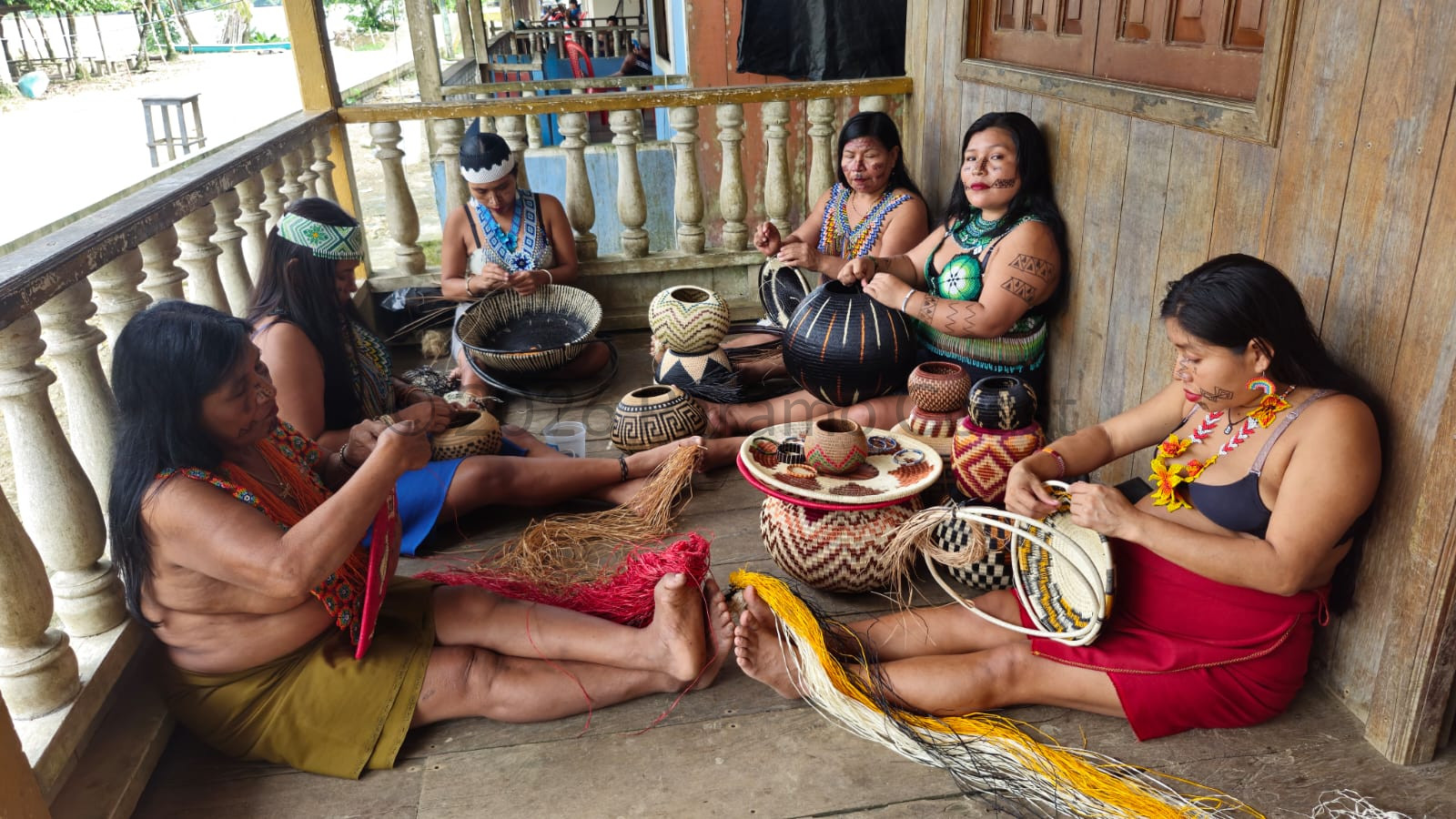 Wounaan artisans weaving baskets and bracelets by hand